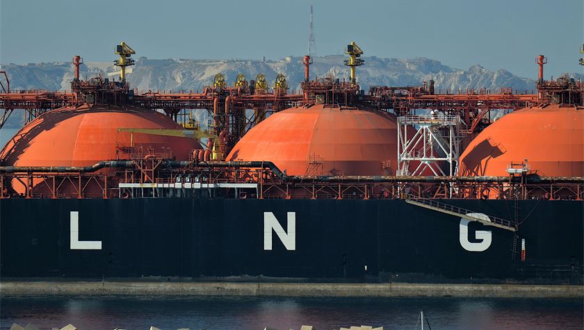 LNG tanker at an export terminal at dusk